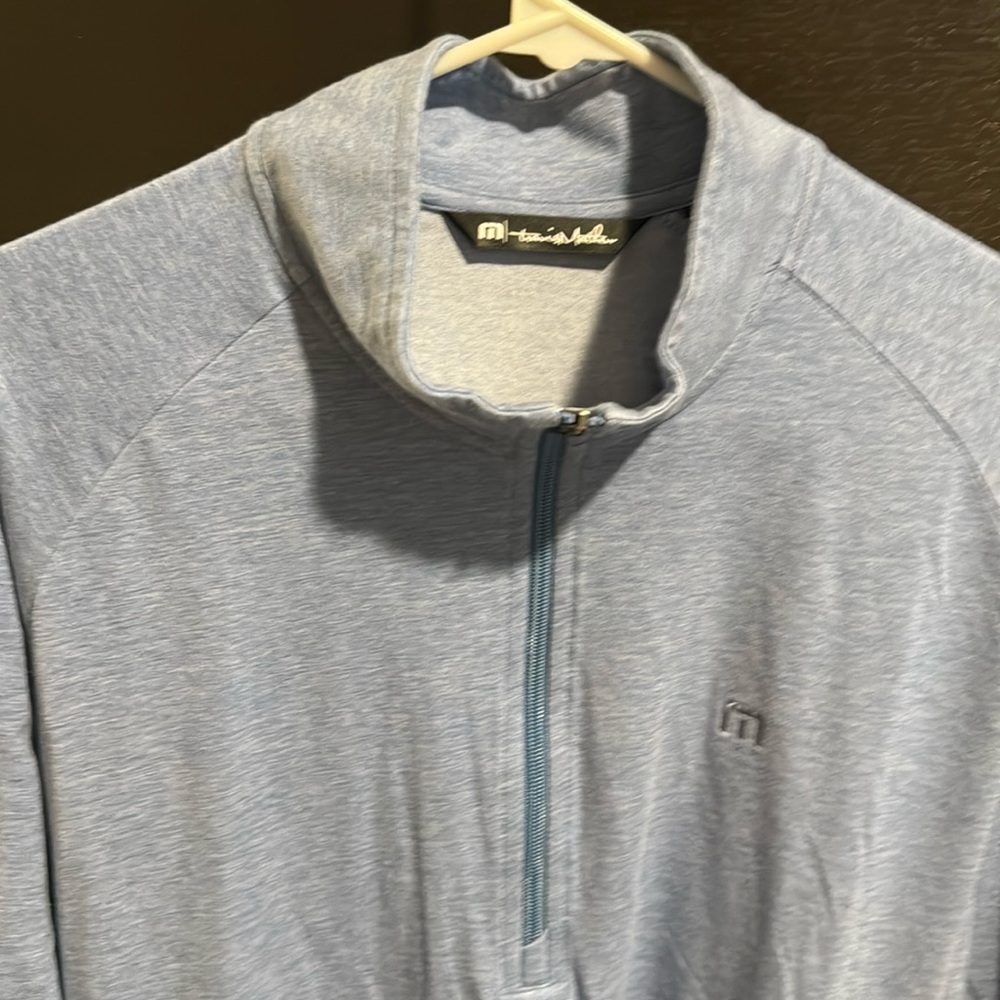 Travis Mathews zip pull over with Tito’s logo